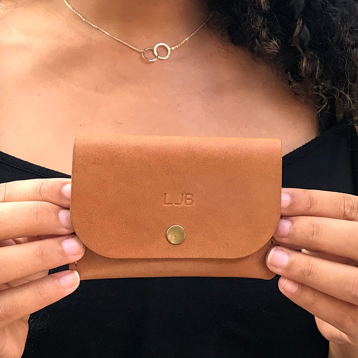 new owner is holding the personalized snap wallet.