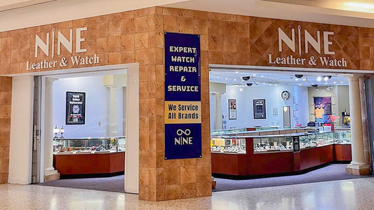 The professional showroom storefront for NINE Leather & Watch in Independence Center, featuring full-grain leather goods and restored watches.