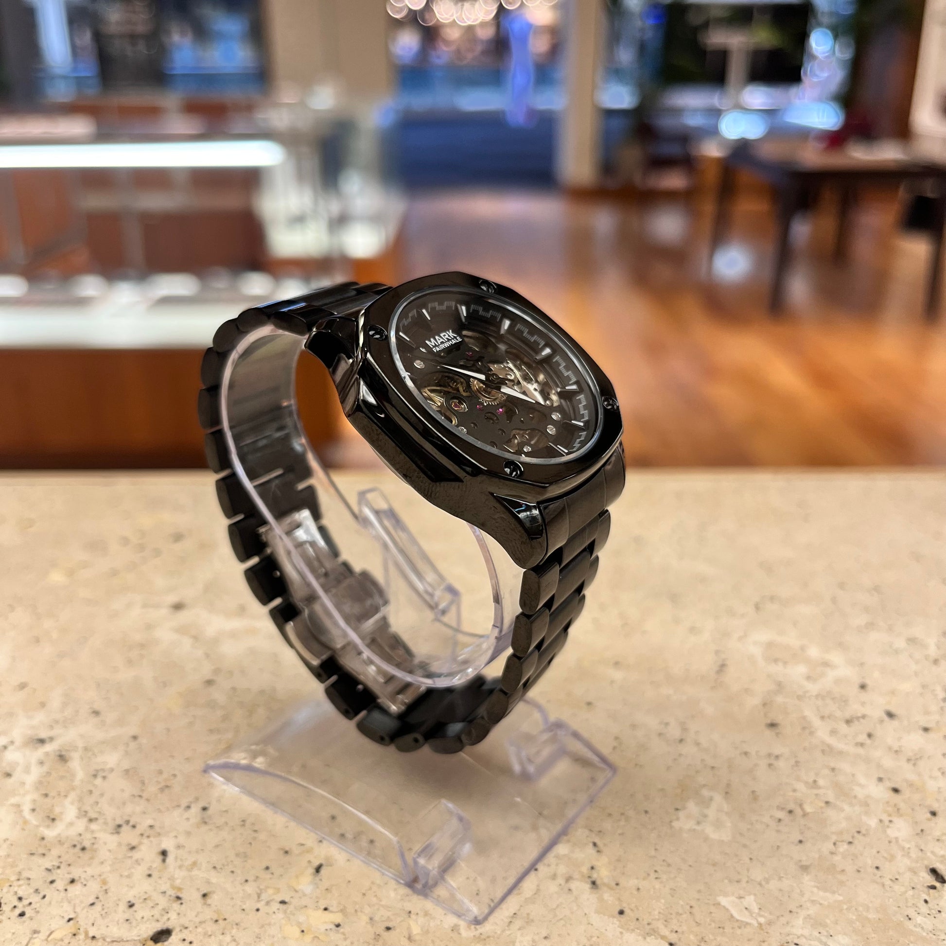 Black Mark Fairwhale Fairwind Automatic watch with partially skeletonized dial, stainless steel case and bracelet, front angle.