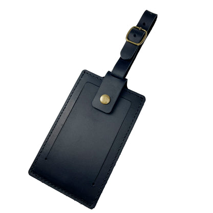 Classic black leather luggage tag with buckle closure and ID window, handcrafted by Nine Leather & Watch.