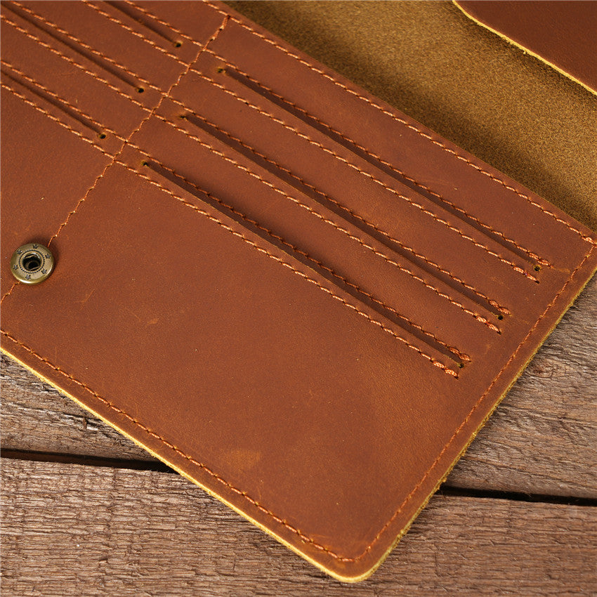 Close-up of tan brown handmade oil waxed leather Long Snap Wallet interior, highlighting the card slots, detailed stitching, and snap closure.