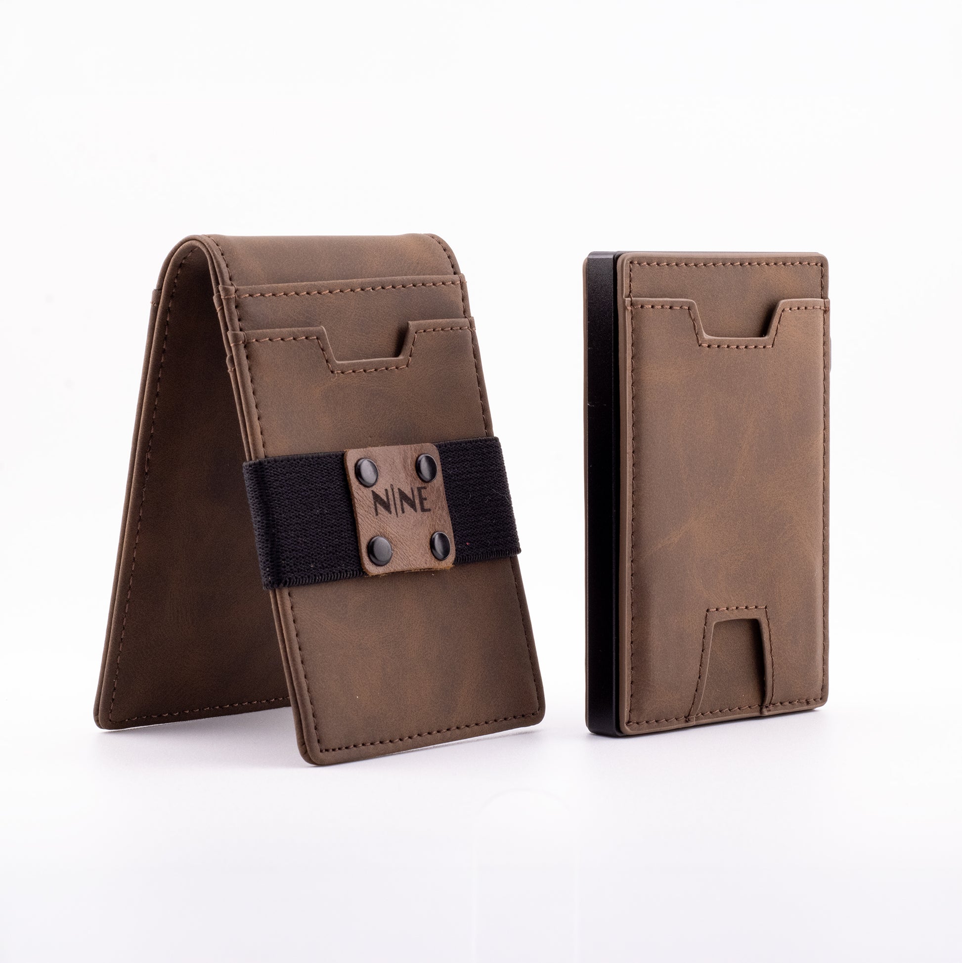 The NINE Leather Magnetic Pop-Up Wallet in brown genuine leather, displaying both the core RFID-blocking cardholder and the upgraded outer sleeve with the NINE branded elastic money strap.