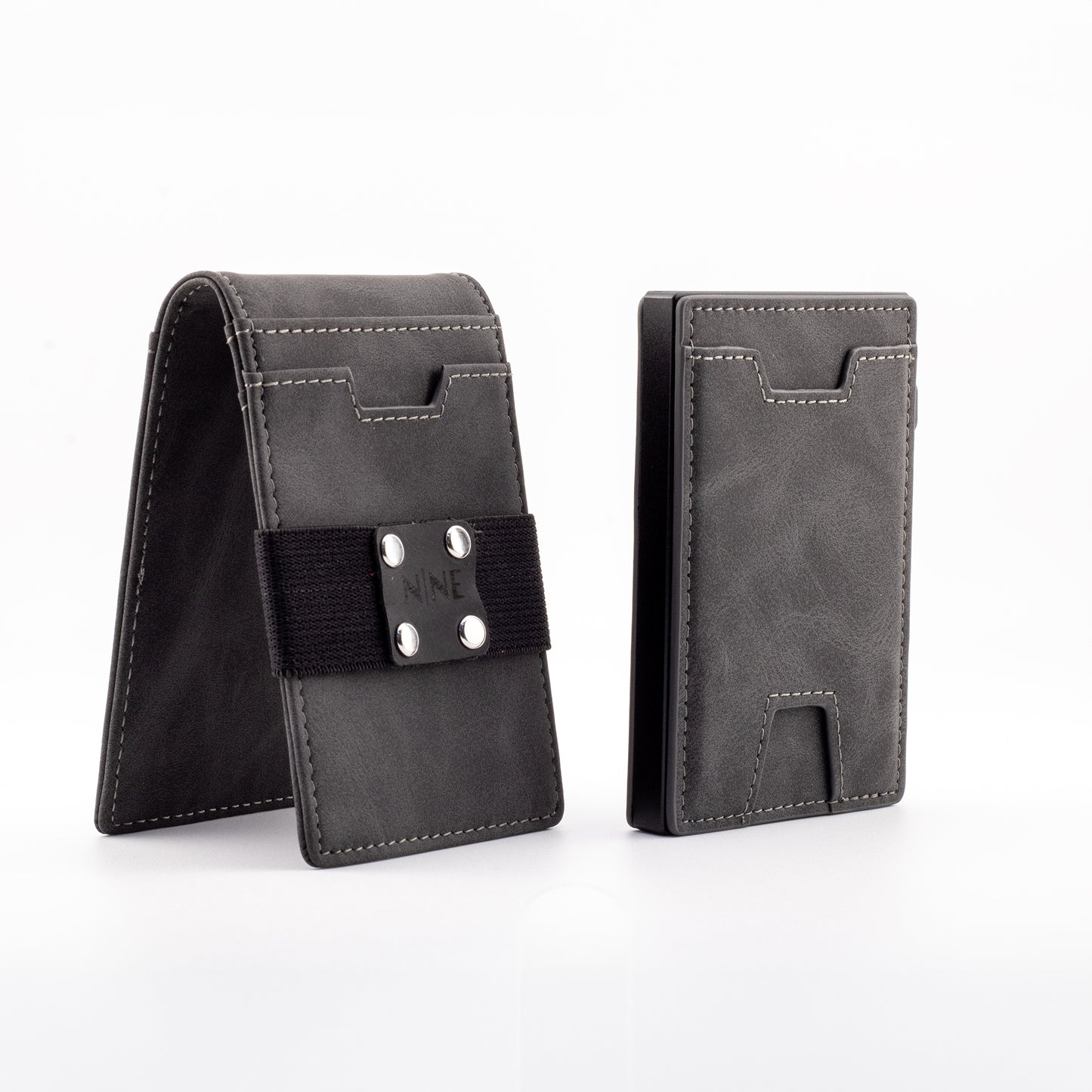 The NINE Leather Magnetic Pop-Up Wallet in gray genuine leather, showing the modular outer sleeve equipped with a black NINE branded money strap next to the slim RFID-blocking core.