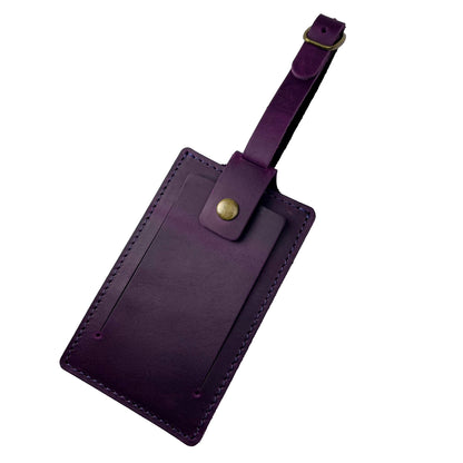 Unique purple leather luggage tag with secure buckle closure, handcrafted by Nine Leather & Watch.