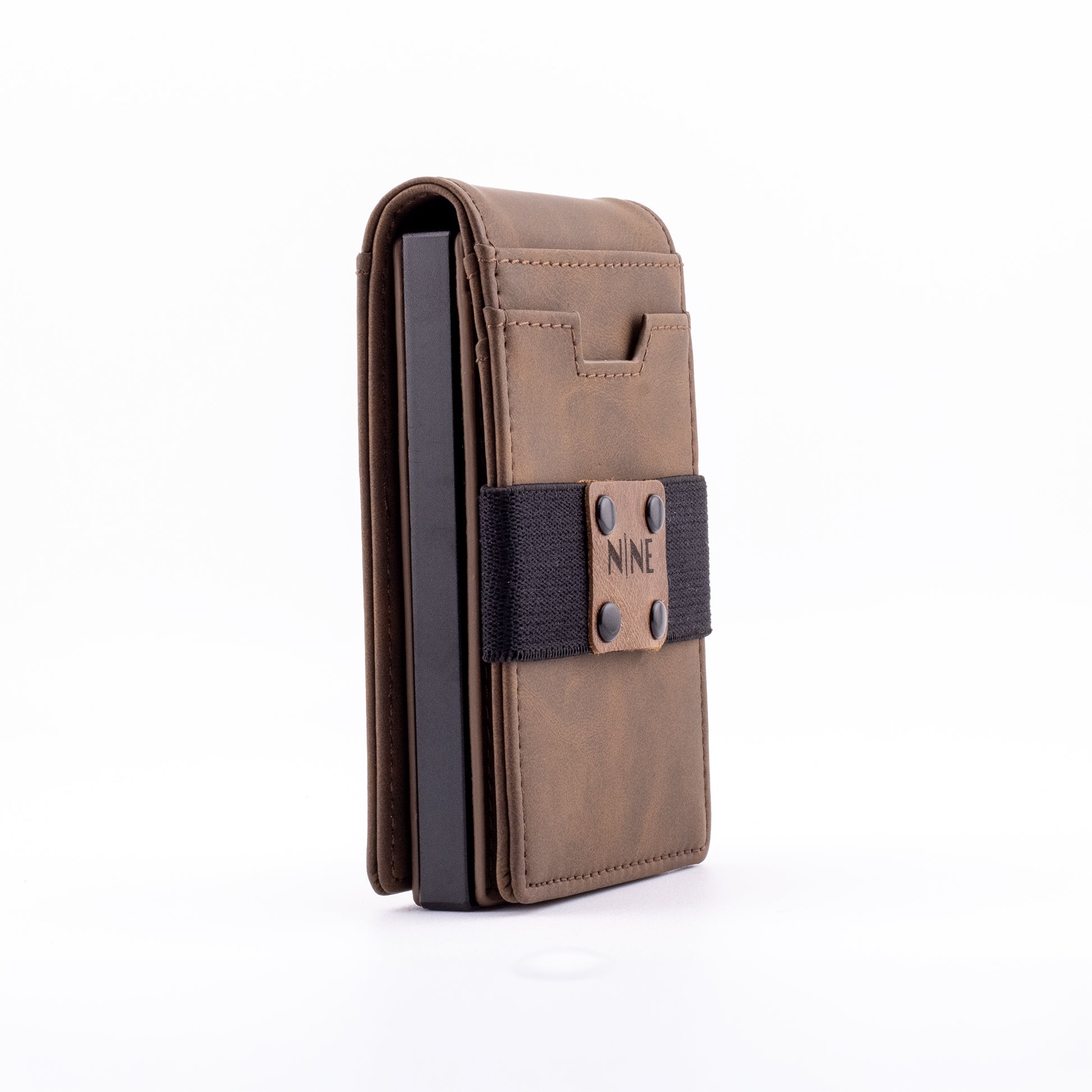 Side profile of the brown genuine leather magnetic wallet equipped with the modular upgrade sleeve, illustrating its ultra-slim footprint designed for everyday carry.