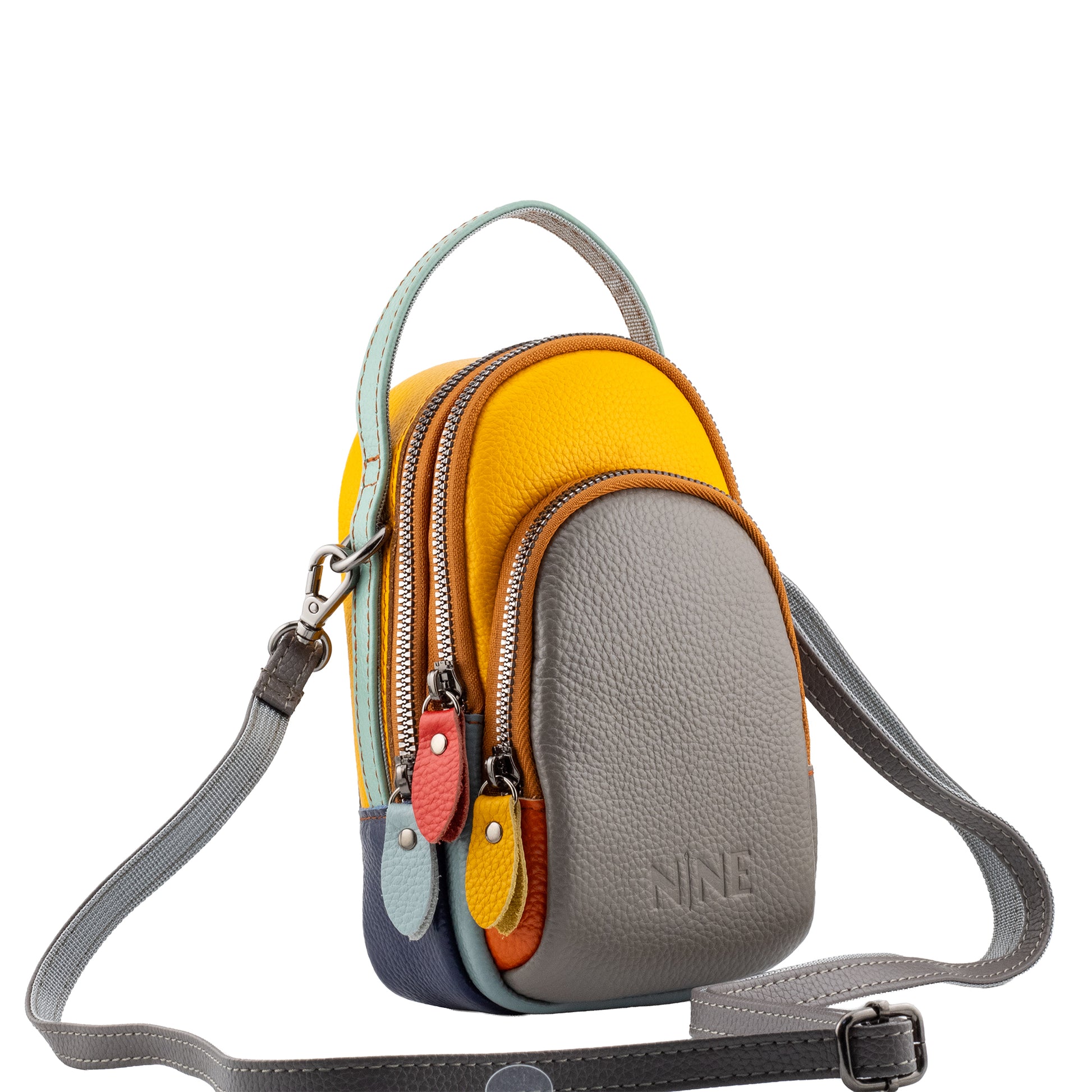 The NINE Leather Sling Candy bag showcasing a gray architectural pebbled front anchor and vibrant yellow middle compartment, beautifully displayed with its adjustable gray leather crossbody strap and polished silver-tone hardware.