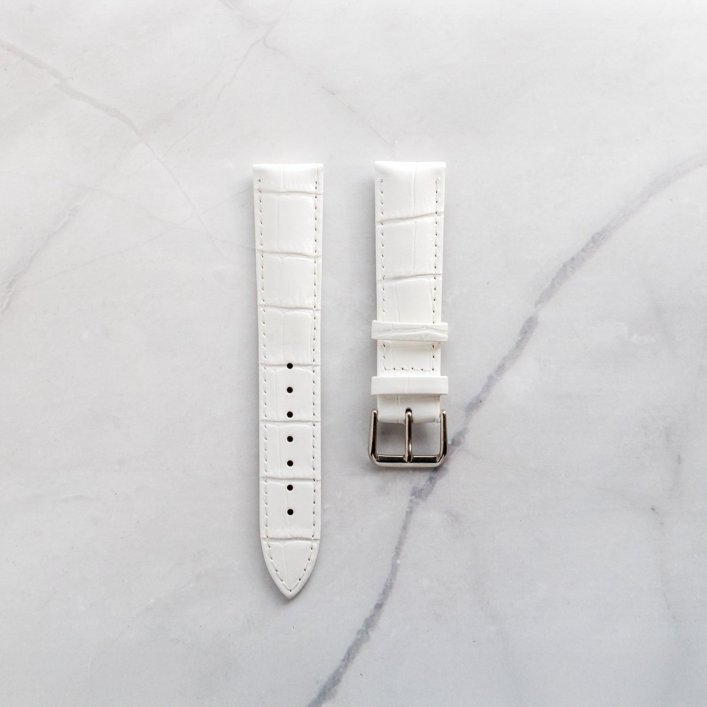 Luxury white genuine leather watch band featuring a deep crocodile skin texture and classic stainless steel buckle.