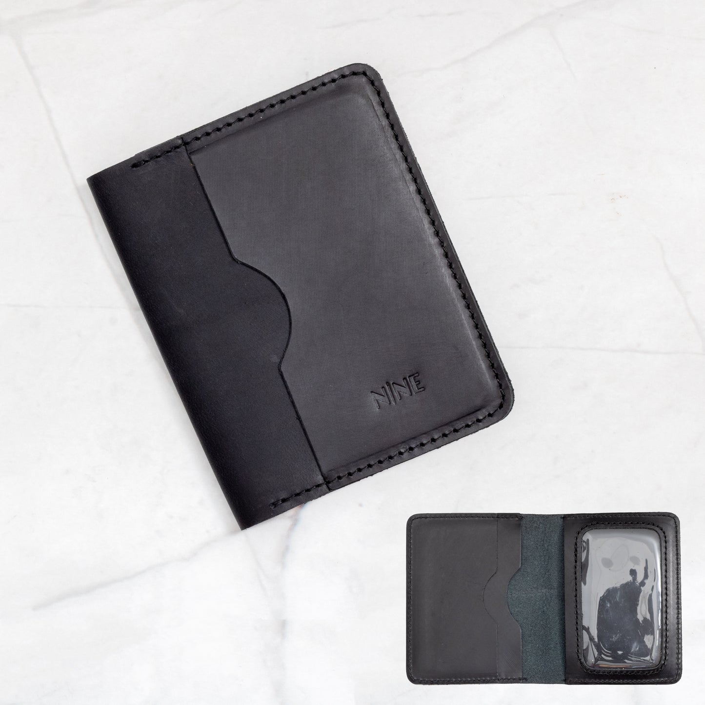 Black Full-Grain Leather Bifold ID Wallet with quick-view clear window and black stitching.
