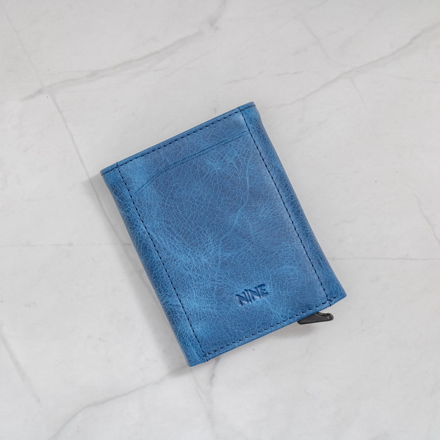 Blue Full-Grain Leather Trifold Pop-Up Wallet with quick-view ID window and snap closure