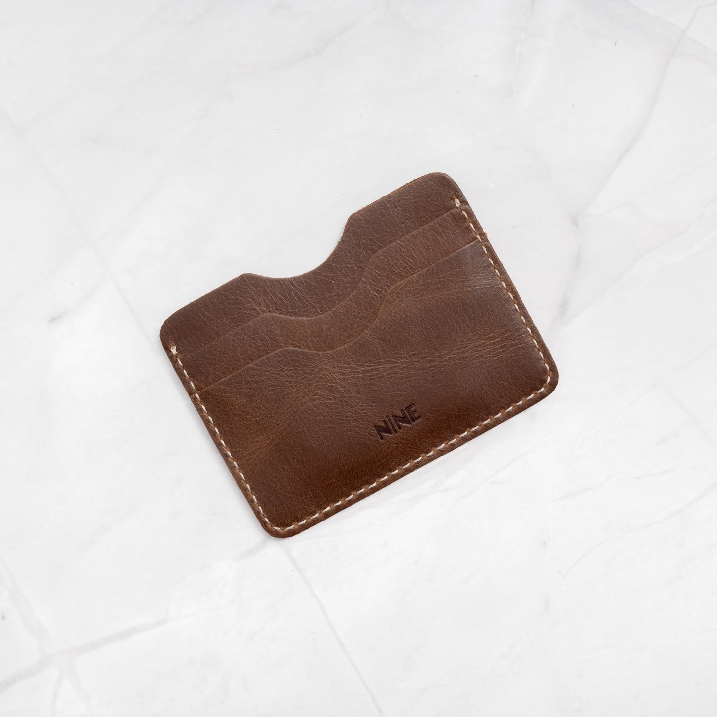 Brown Full-Grain Leather Compact Card Wallet (No. 4), showcasing the premium texture.