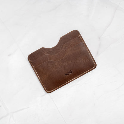 Brown Full-Grain Leather Compact Card Wallet (No. 4), showcasing the premium texture.