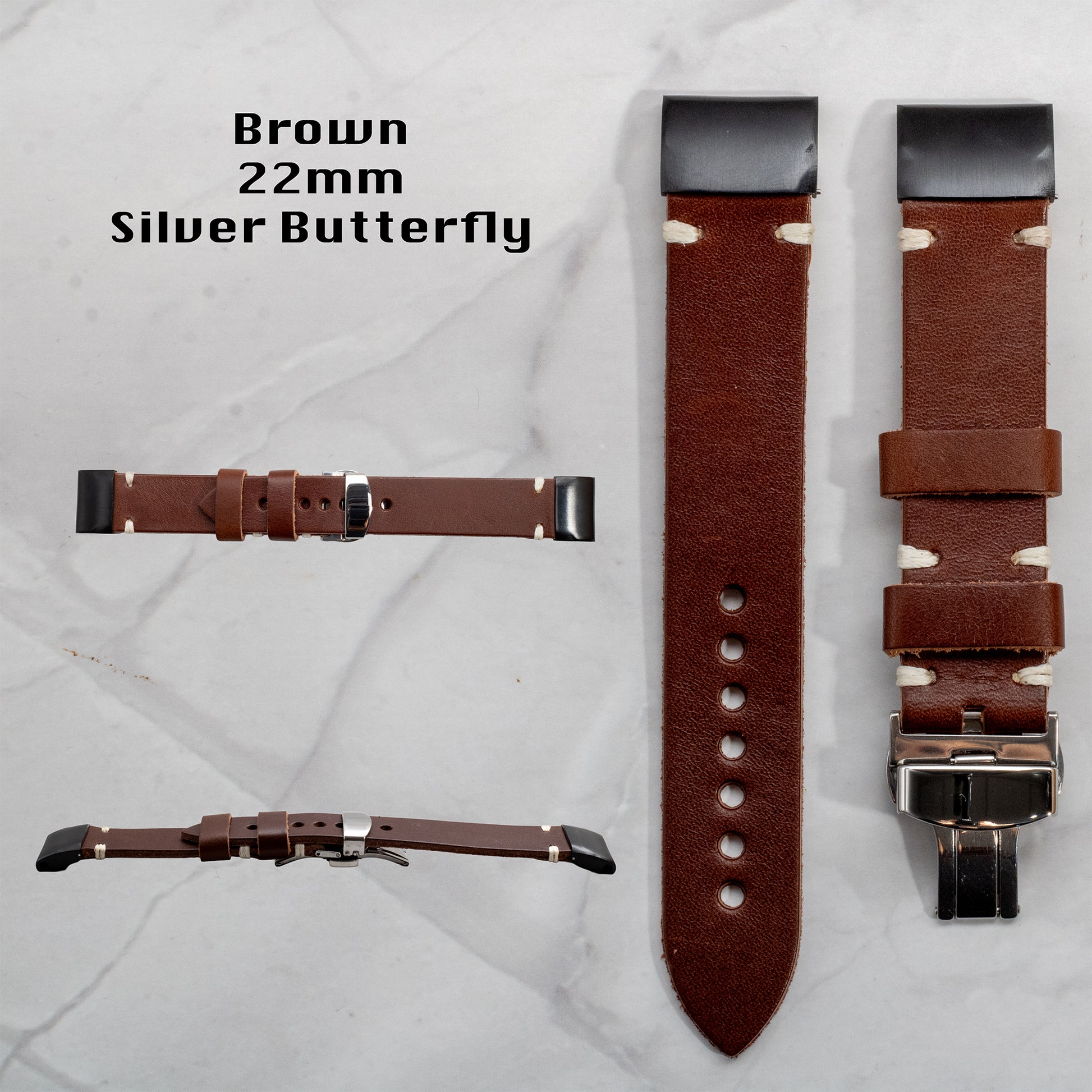 Brown full-grain leather Garmin replacement watch band, 22mm width, featuring white contrast stitching, black connectors, and a silver butterfly clasp. Displayed from multiple viewing angles.