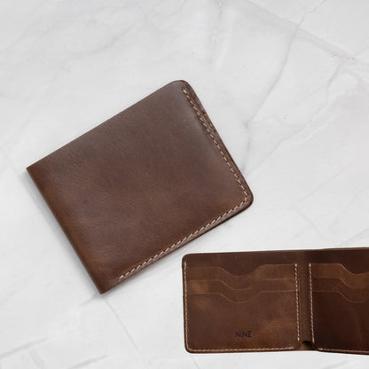 Dark Brown Full-Grain Leather Classic Bifold Wallet with 6 card slots and contrast stitching.