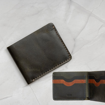 Green and Tan two-tone Full-Grain Leather Classic Bifold Wallet with a slim profile and 6 card slots.