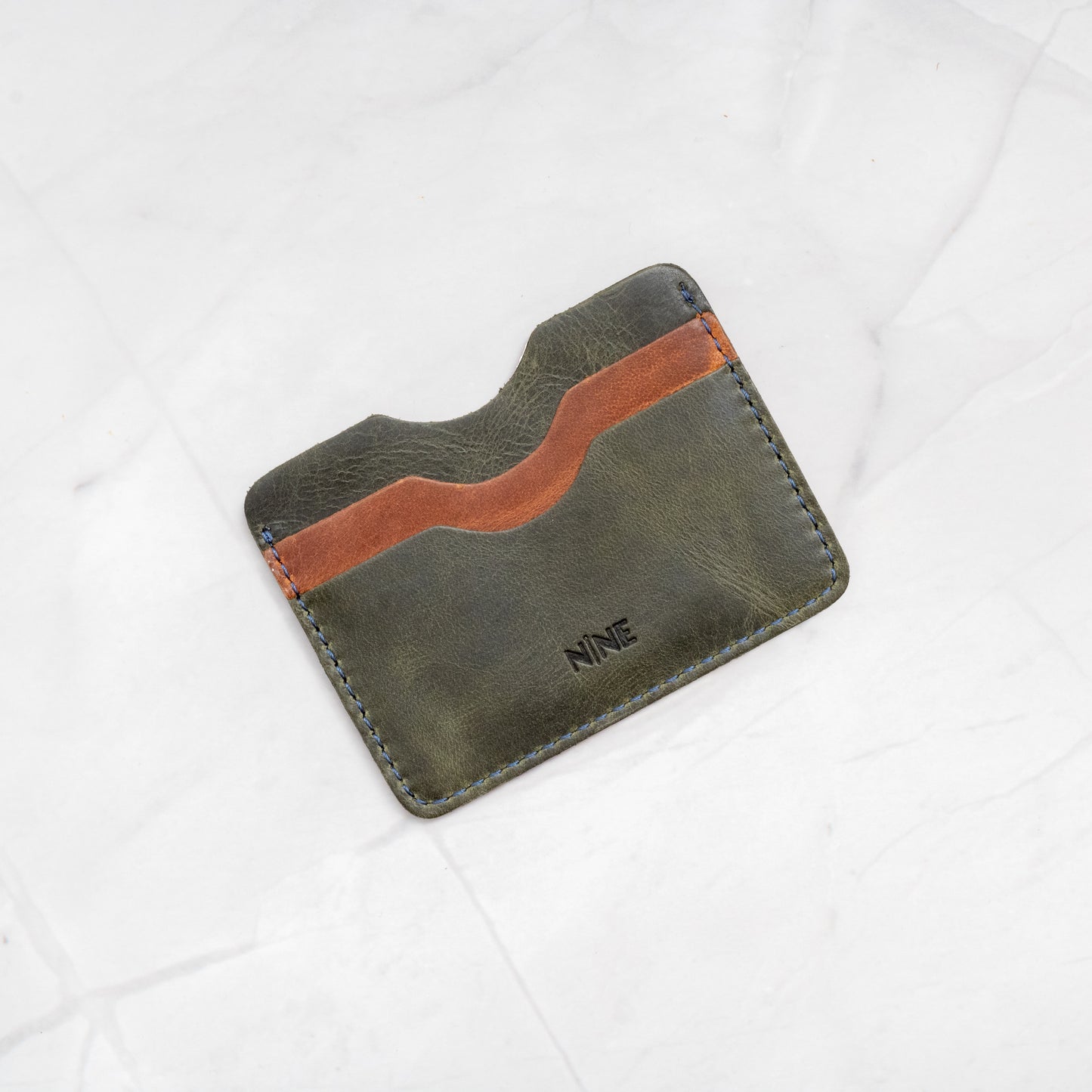 Green and Tan two-tone Full-Grain Leather Compact Card Wallet, highlighting the organized 4-slot layout.