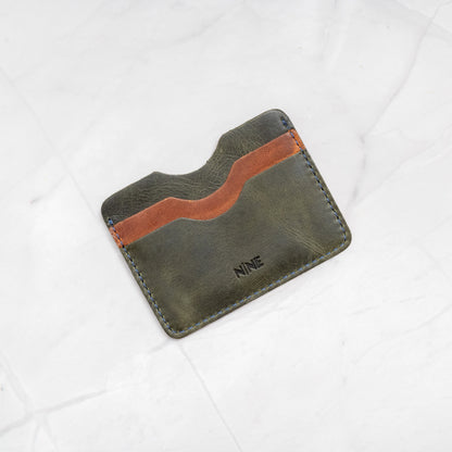 Green and Tan two-tone Full-Grain Leather Compact Card Wallet, highlighting the organized 4-slot layout.