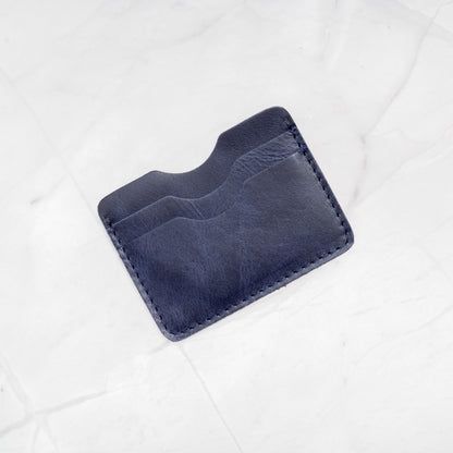 Navy Full-Grain Leather Compact Card Wallet, showing 4 card slots and central cash storage.