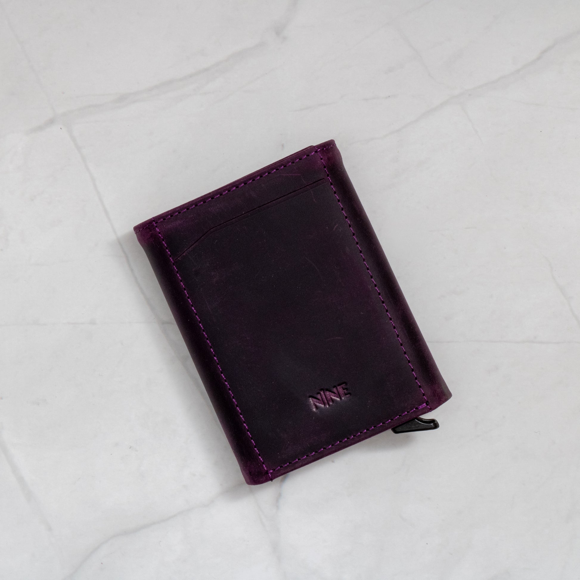 Purple Full-Grain Leather Trifold Pop-Up Wallet with quick-view ID window and snap closure