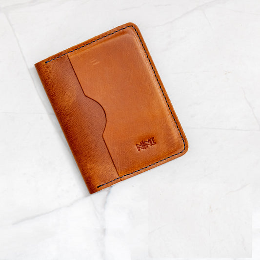 Tan Full-Grain Leather Bifold ID Wallet with blue stitching and interior quick-view ID sleeve.