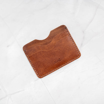 Tan Full-Grain Leather Compact Card Wallet, demonstrating the small size and durable quality.