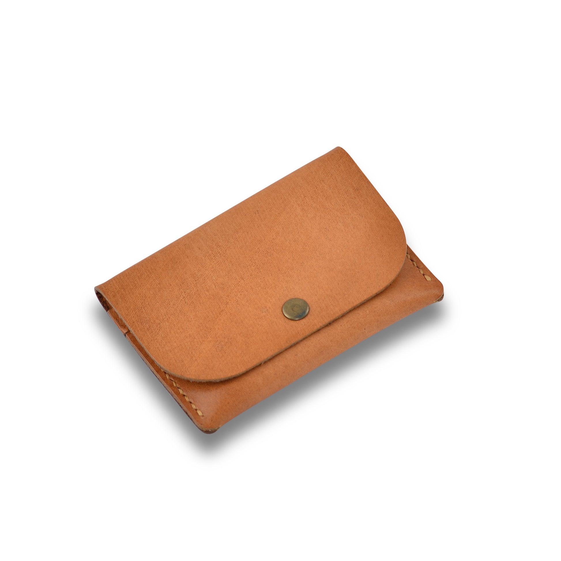  A tan brown full-grain leather Snap Wallet, closed with a snap closure, showcasing its slim profile and minimalist design.